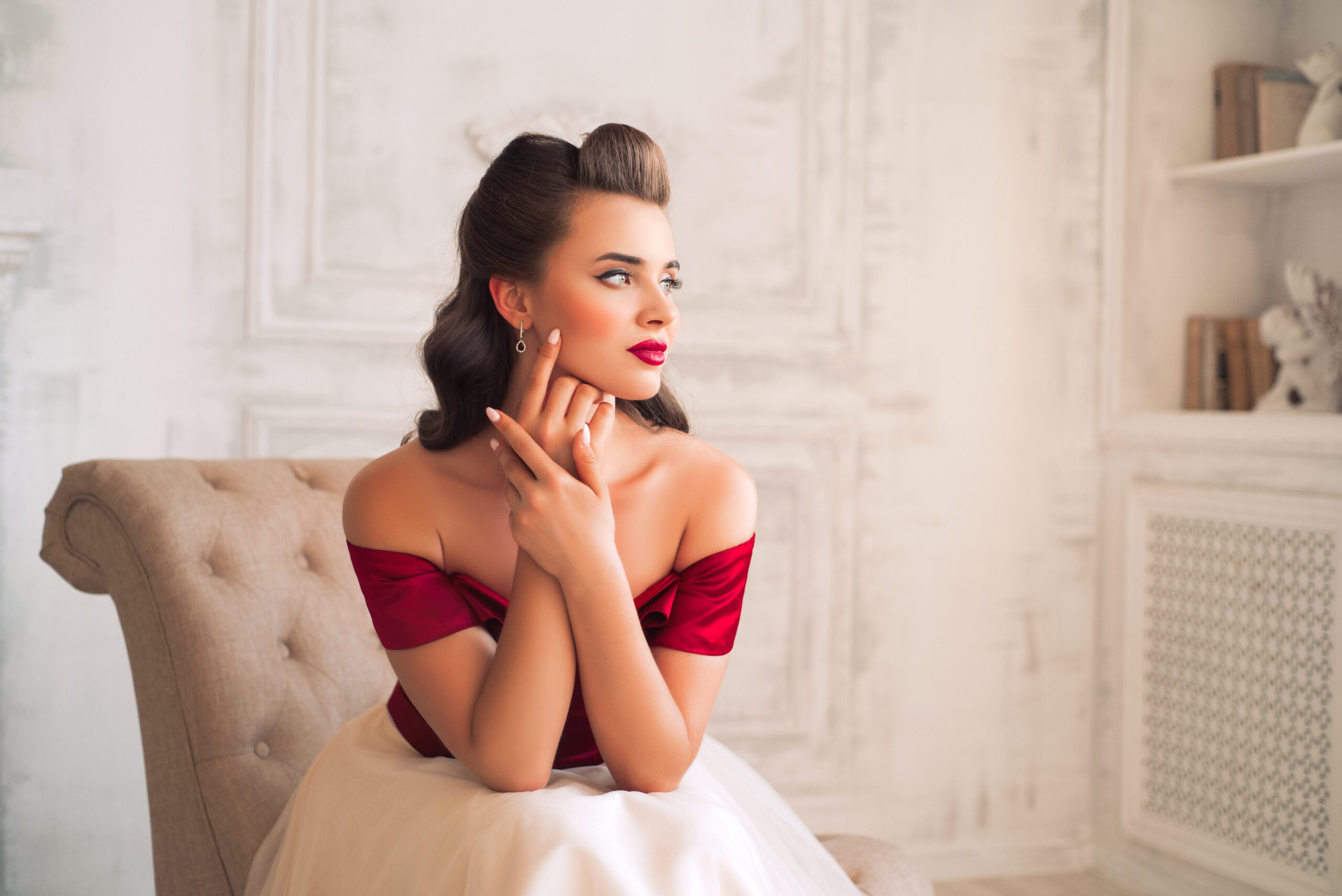 Who offers Sculptra injections near me in Colorado Springs? - Beautiful flirtatious girl as a pin up model in dress in retro interior