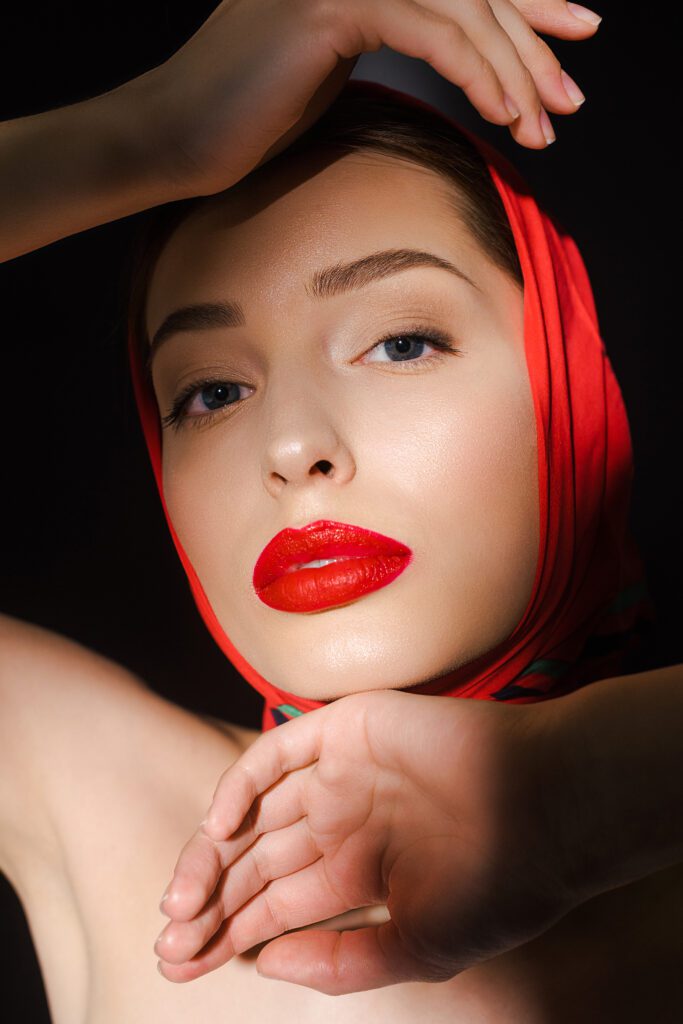Timeless Aesthetics, LLC | Is Morpheus8 Better Than Traditional Microneedling for Acne? what are the key differences between Botox, Dysport, and Jeuveau for reducing dynamic facial lines? - portrait of attractive elegant woman with red scarf, isolated on black