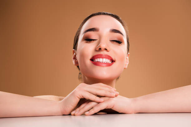 A young beautiful woman happy after Restylane Lip Filler in Colorado Springs